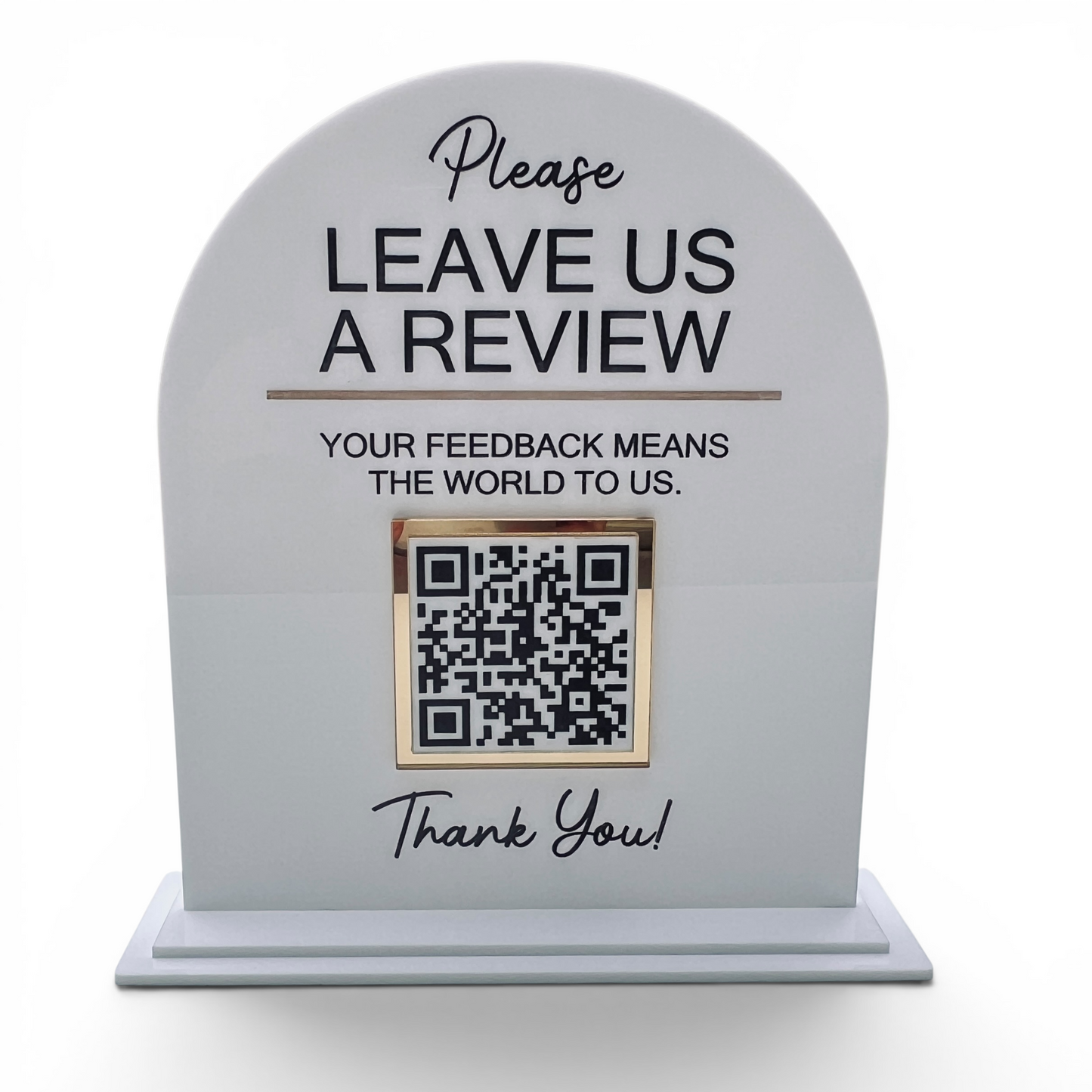A white QR Code display with an arched top and base, engraved with the text 'Please LEAVE US A REVIEW' and a QR code, on a white background.