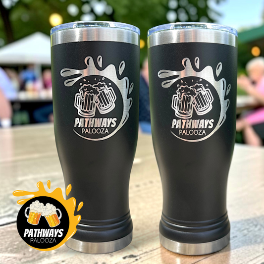 Two black tumblers with 'Pathways Palooza' logo on a wooden table outdoors.