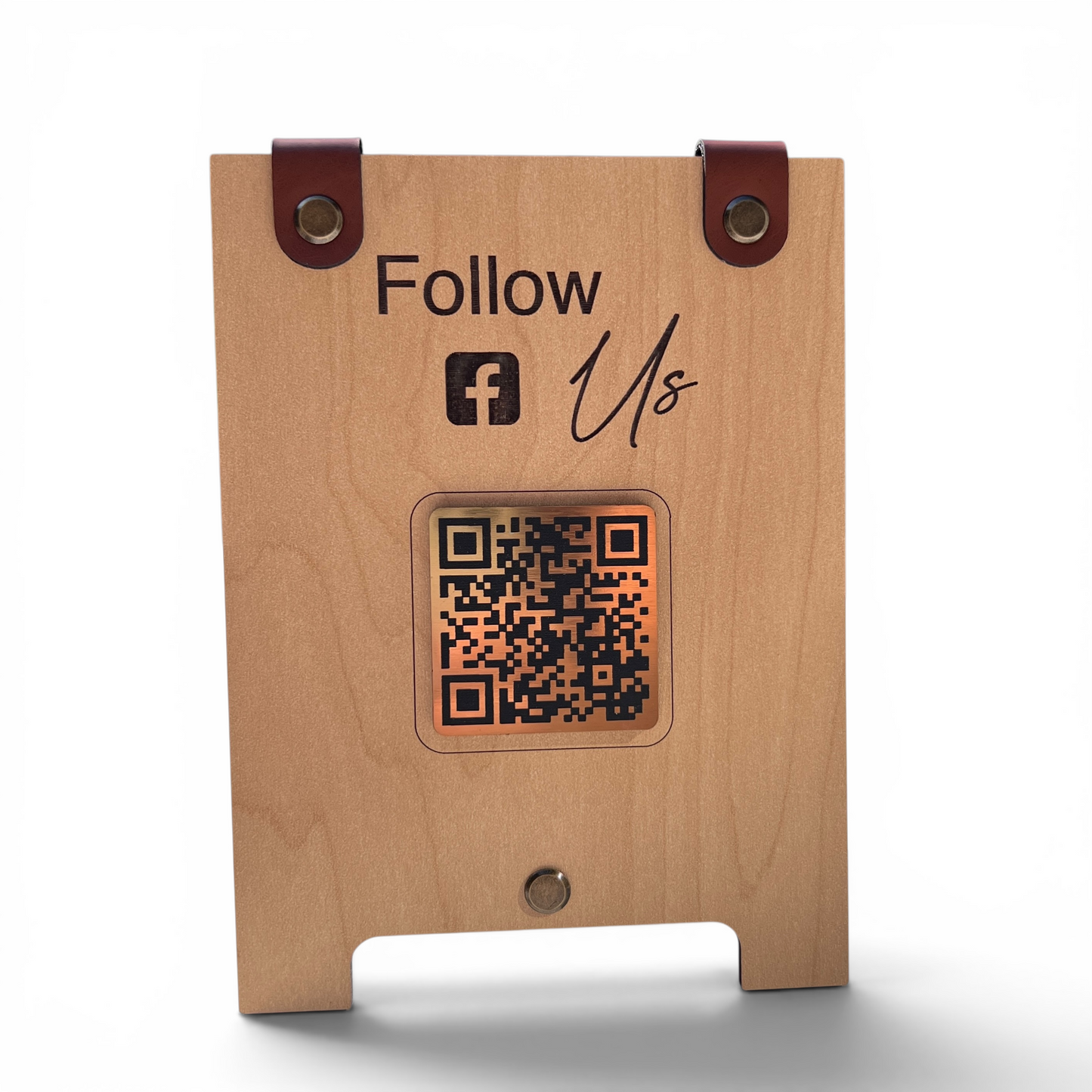A wooden tabletop sign with a QR code window and 'Follow Us' text with the Facebook logo, shown on a white background.