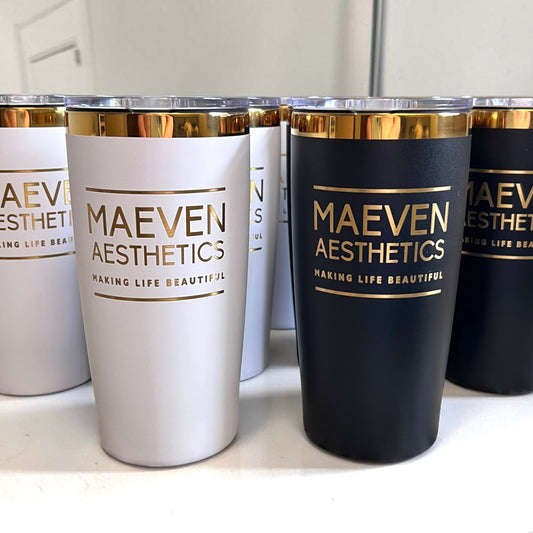 Set of tumblers with 'MAEVEN AESTHETICS' branding on a white surface.